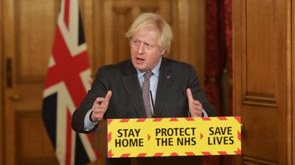 Boris Johnson speaks during a press conference at Downing Street
