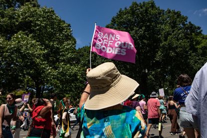 Abortion-rights activists march to the U.S. Supreme Court on June 24, 2023 