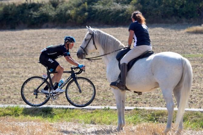 Vasil Kiryienka (Team Sky) passes a fan on a horse