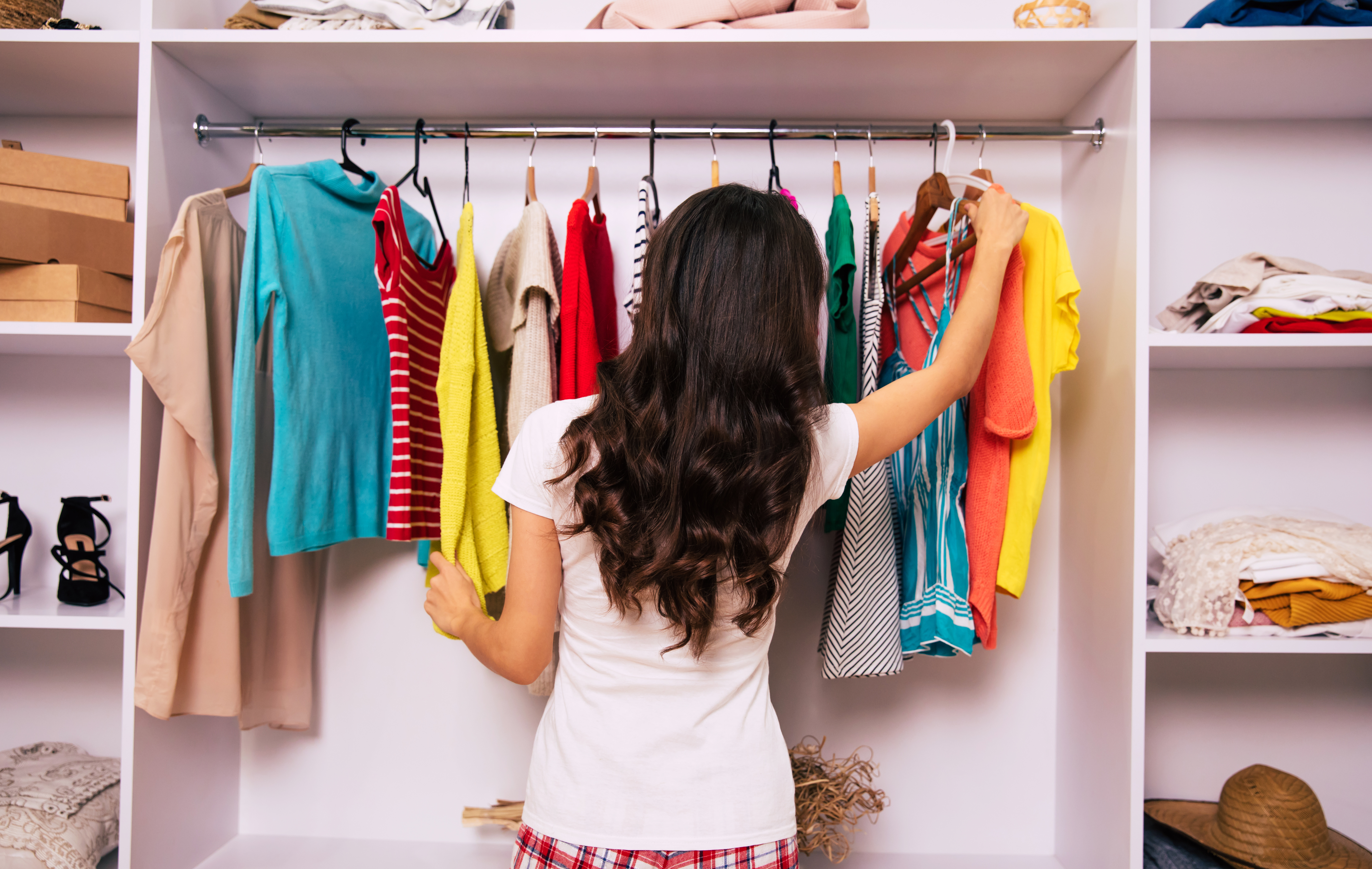 woman in front of clothes closet