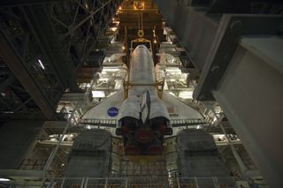 In the Vehicle Assembly Building at NASA's Kennedy Space Center in Florida, shuttle Atlantis is lowered toward the mobile launcher platform where it will be joined with its external fuel tank and solid rocket boosters on May 18, 2011. Atlantis will launch