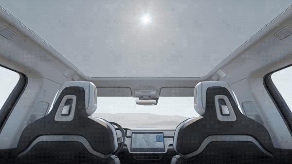 Rivian R1s panoramic roof with sun passing overheard
