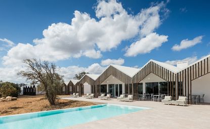 Swimming Pool area of the Sobreiras Alentejo Country Hotel with plenty of loungers facing the pool