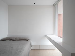White minimalist bedroom at red box house in China