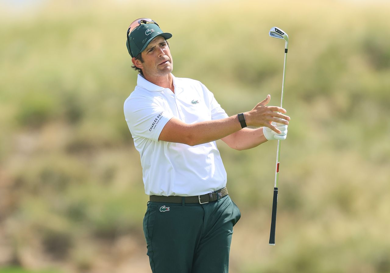 Nacho Elvira hits a wedge shot and watches its flight
