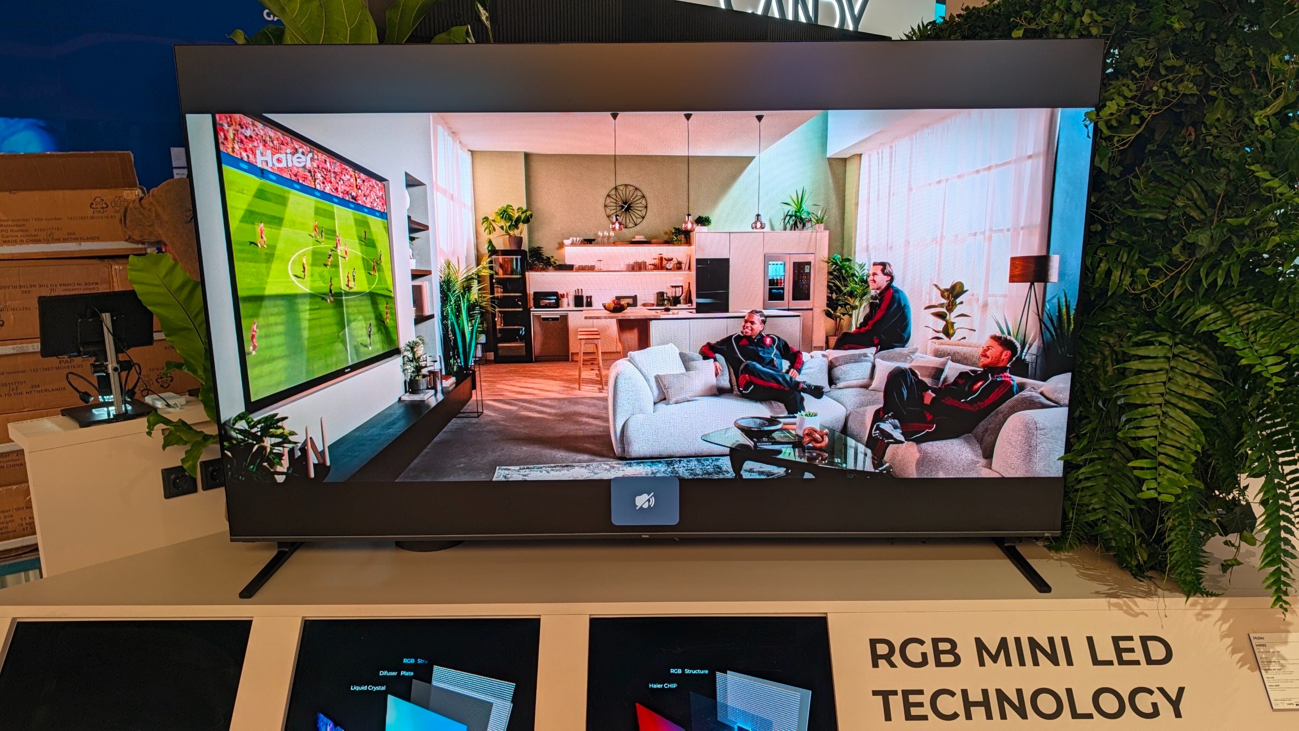 A Haier TV on a stand at IFA