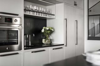 a kitchen with buster + punch handles