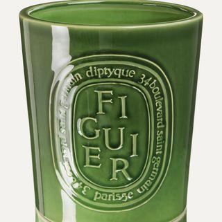 A green earthenware candle