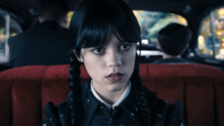 Jenna Ortega sitting in a car in the first episode of Wednesday
