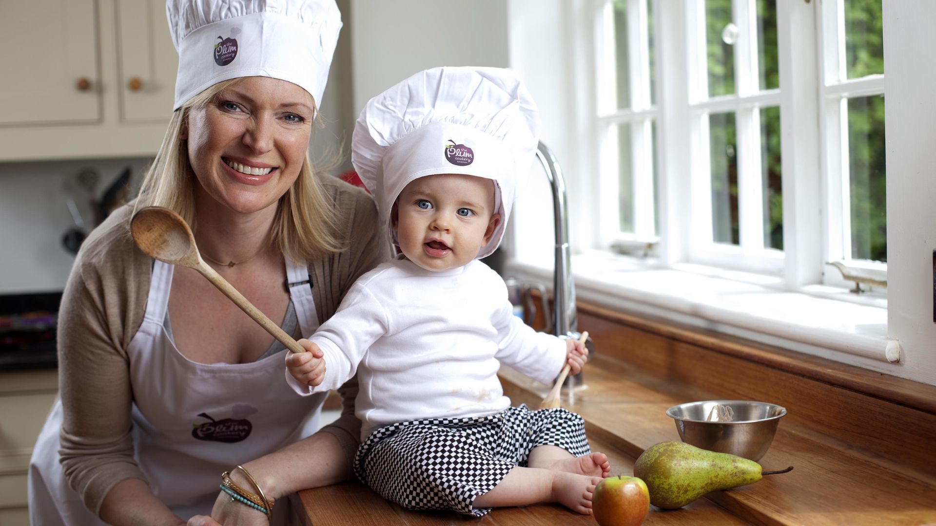 Rachel Allen with a baby holding a spoon