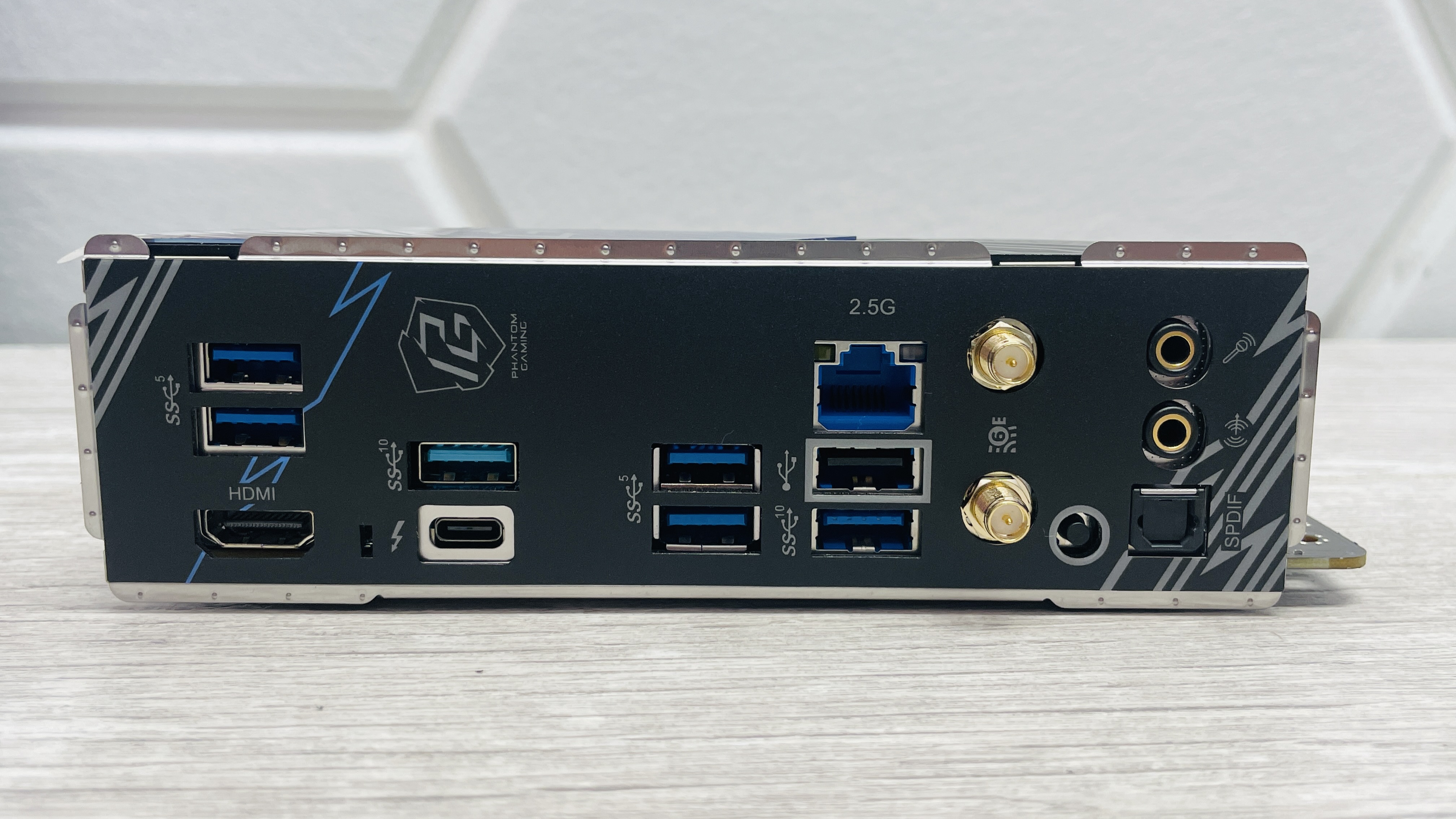 ASRock Phantom Gaming B860I Lightning Wi-Fi motherboard on a desk.