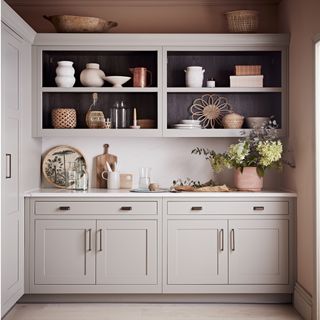 kitchen with cashmere cupboards and cabinets with ceramic vases and pots