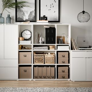 living room with white modular shelving unit