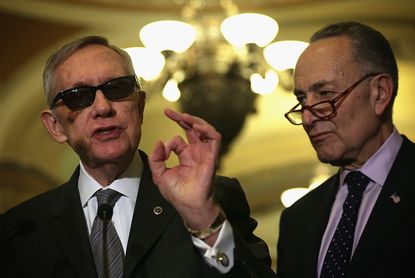 U.S. Senate Minority Leader Sen. Harry Reid (D-NV) (L) and Sen. Charles Schumer (D-NY) (R)