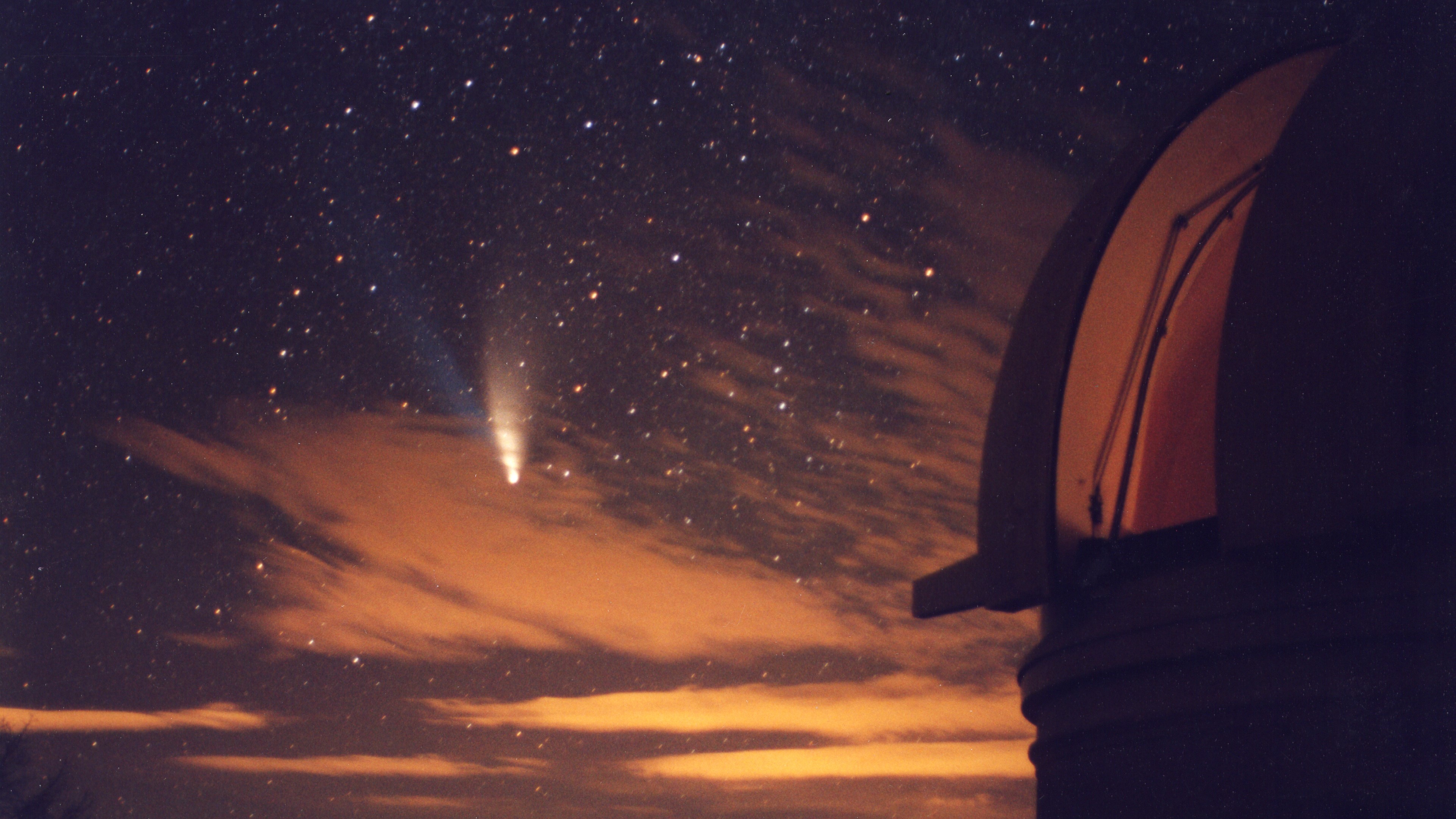 Hale-Bopp comet won't return to the inner solar system for thousands of years. This image shows Comet Hale-Bopp with Palomar Mountain's 48 inch telescope in the foreground.