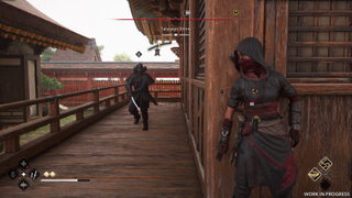 Naoe waits round a corner as an enemy approaches in Assassin's Creed Shadows