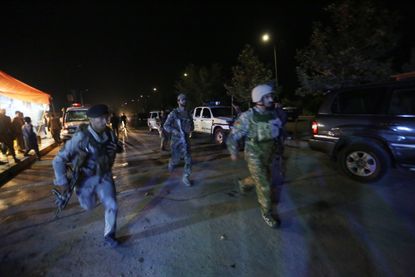 Afghan security forces rush to respond to a complex Taliban attack on the campus of the American University in the Afghan capital Kabul.