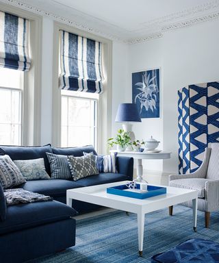 A blue and white living room picture with corner sofa and shibori designs