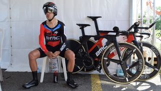 Richie Porte prepares himself for the stage alongside his BMC Timemachine