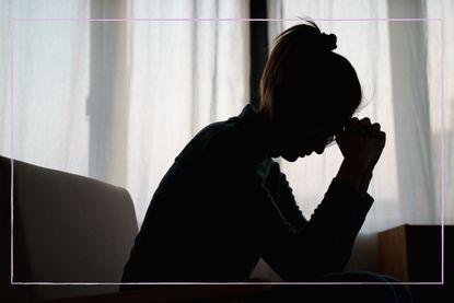 Silhouette of a stressed woman