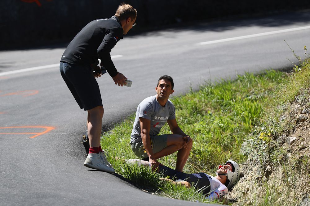 Edward Theuns of Trek-Segafredo lies injured after a crash during the 37km Individual Time Trial stage 13 of the Tour de France