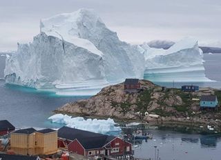 An iceberg just grounded outside the village of Innarsuit in northwestern Greenland, shown here on July 13, 2018.