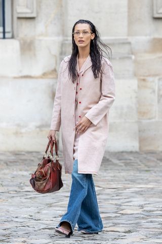 An image of Bella Hadid wearing flared jeans.