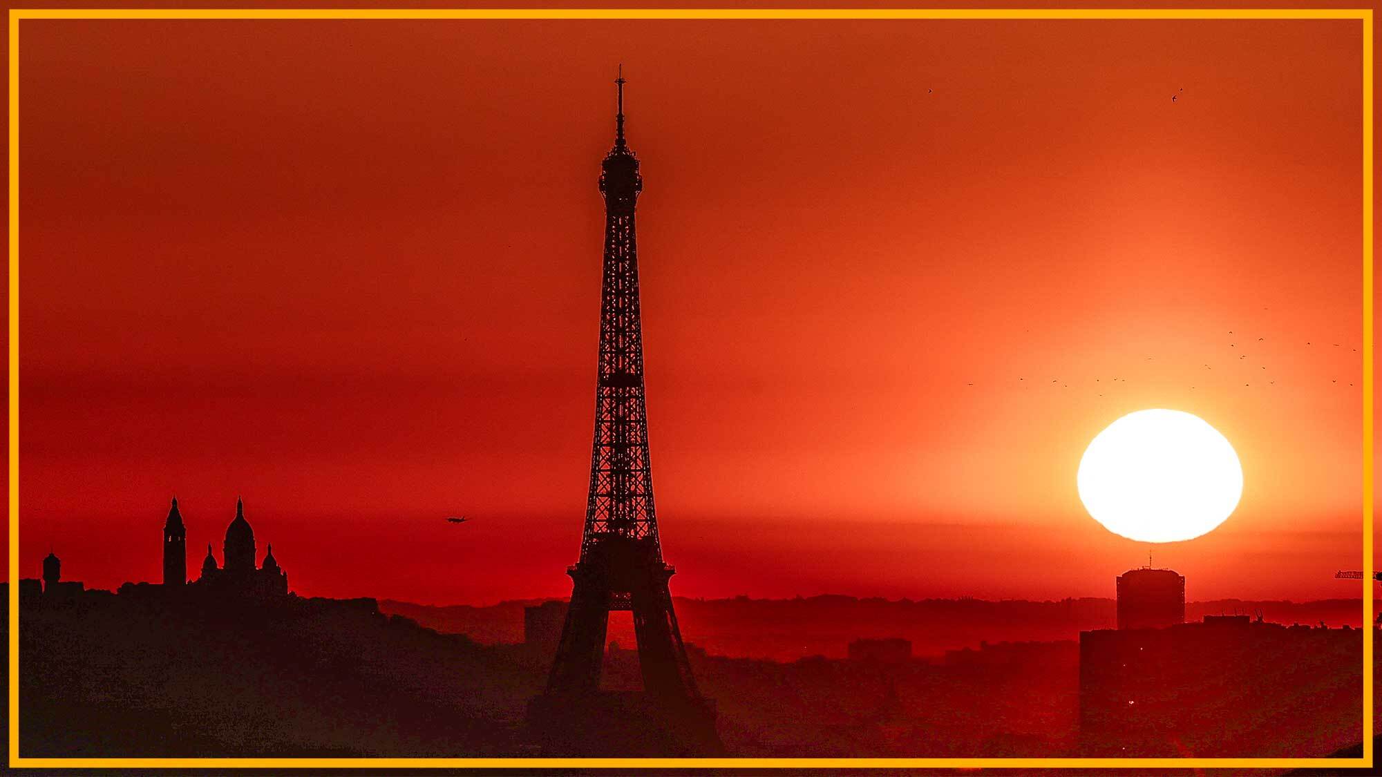 Paris with Eiffel Tower and orange sunset