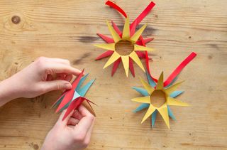 Fold the points back to create a star toilet roll Christmas decoration