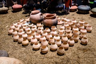 Traditional Xhosa clay vessels photographed outside at Ngobozana, Eastern Cape