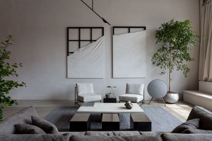 A neutral living room with a beige Roman Clay painted wall
