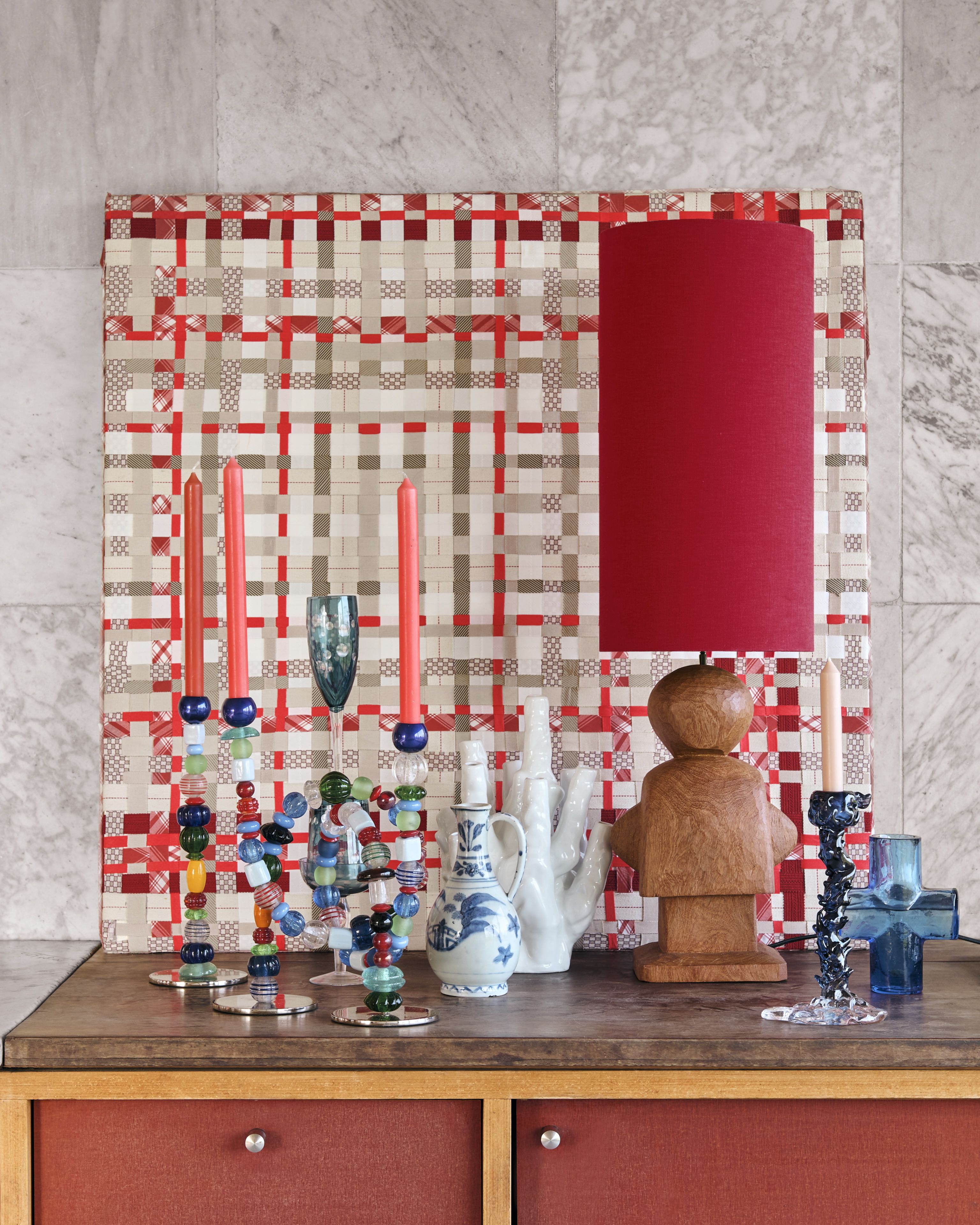 a number of beaded candlesticks with candles