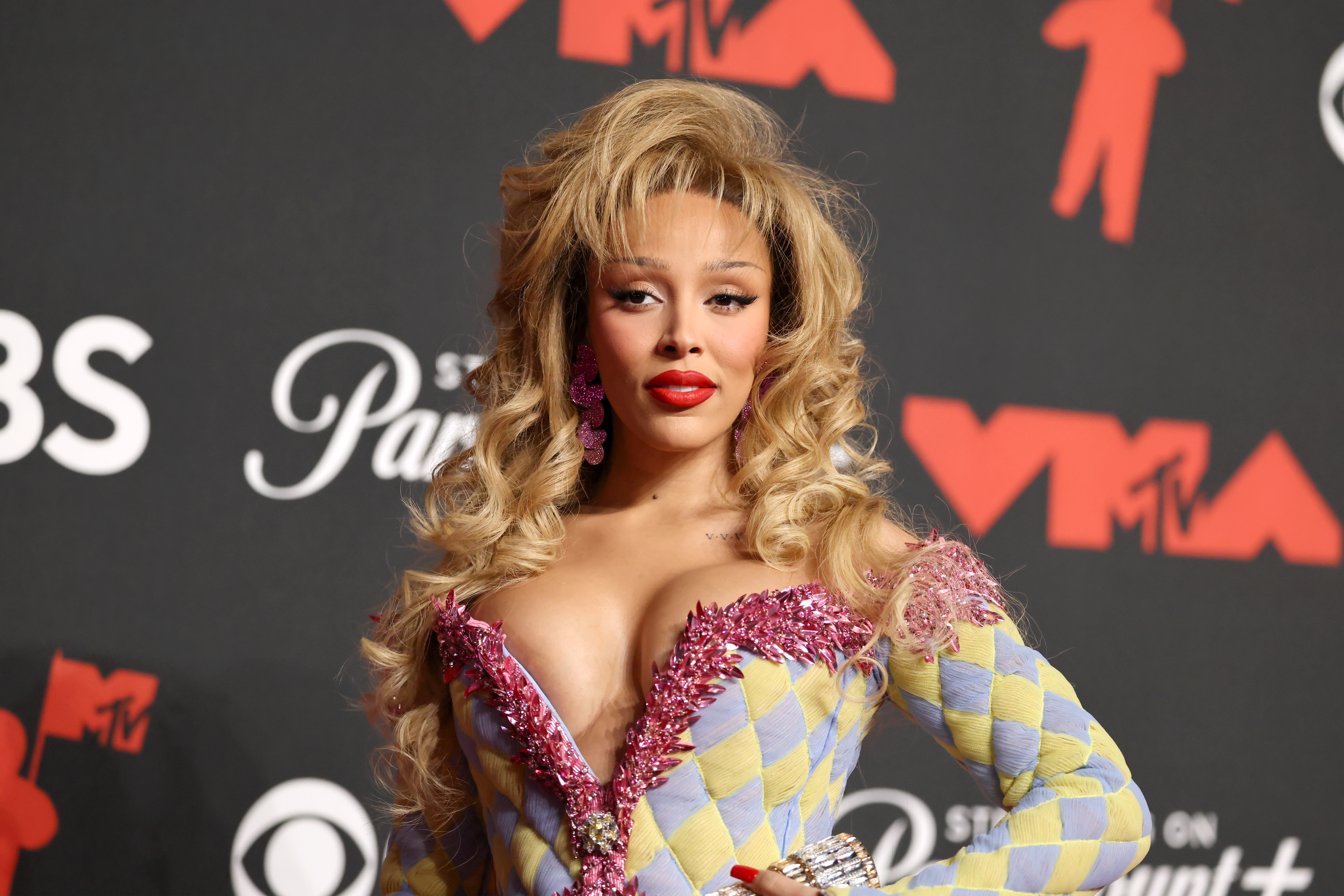 a woman with blonde hair wearing red lipstick
