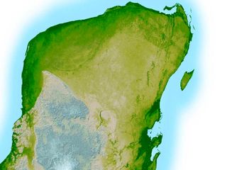 In this computer-enhanced image, Chicxulub crater's outer boundary is visible as the semi-circular, darker green line in the Yucatan Peninsula's upper left corner — a trough that’s just 10 to 15 feet (3 to 5 meters) deep and 3 miles (5 kilometers) wide.