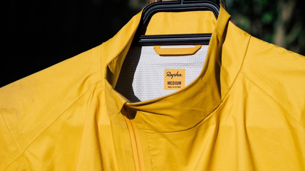 A yellow rapha core waterproof jacket