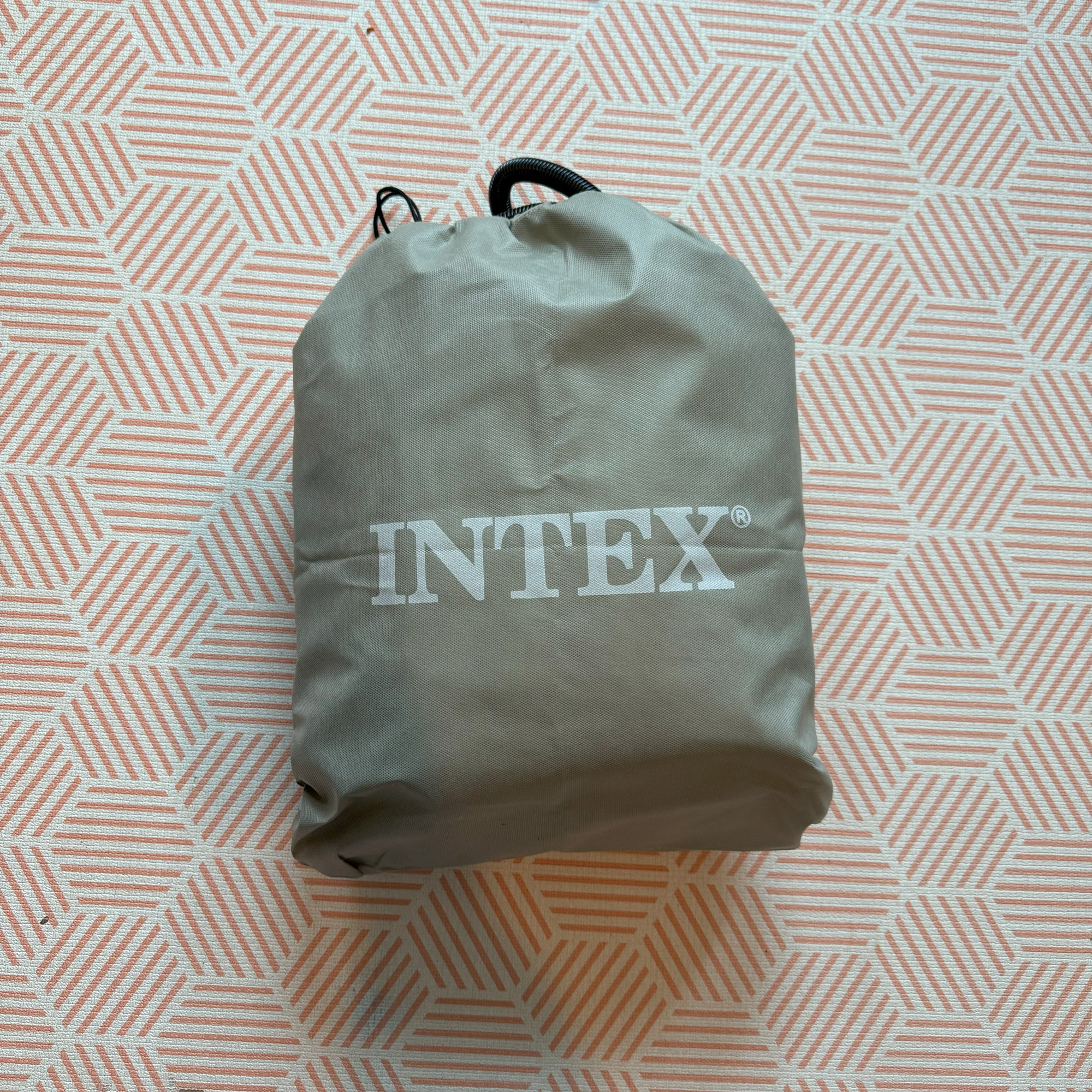 The Intex Kidz Travel Bed with Hand Pump being tested