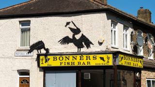 A mural purportedly by the artist Banksy, showing pelicans eating fish, adorns the side of Bonners fish and chip shop on August 09, 2024 in Walthamstow, England