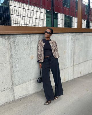 woman in leopard print jacket and jeans