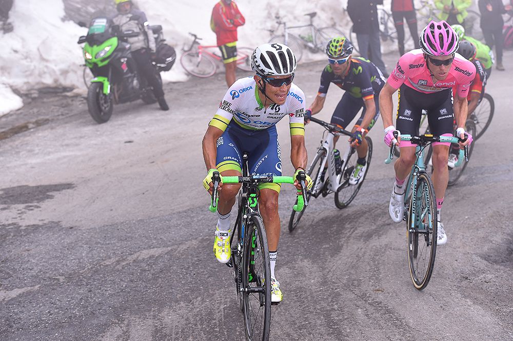 Esteban Chaves climbs next to Steven Kruijswijk during stage 19