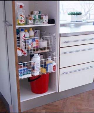 wire pull out baskets in white cupboard