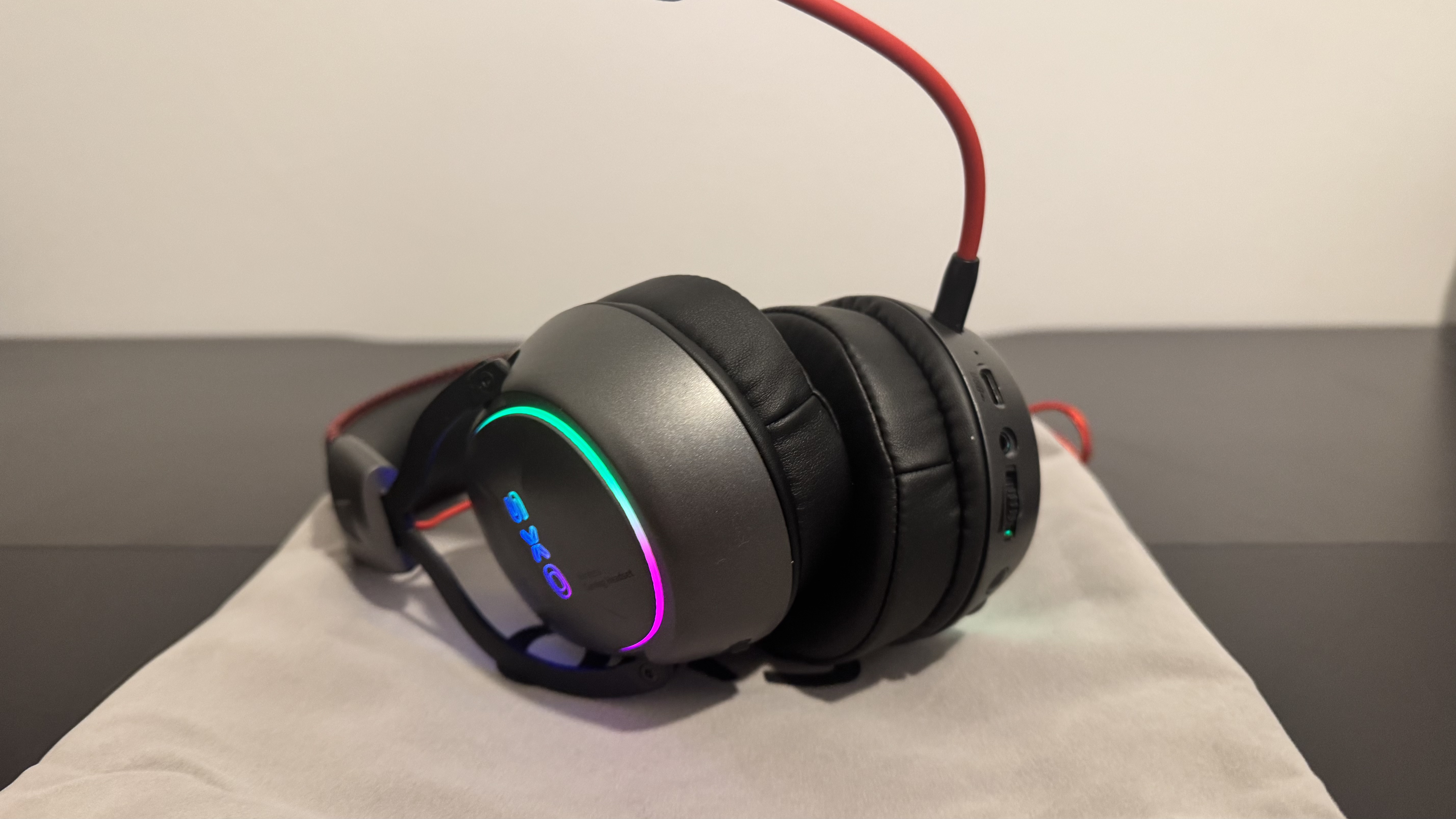 The OXS Storm G2 gaming headset on a black table