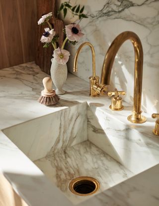 Marble sink with gold taps
