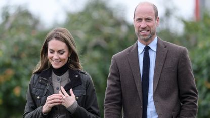Catherine, Princess of Wales and Prince William, Prince of Wales walk during a visit to Long Meadow Cider on October 14, 2025 in Craigavon