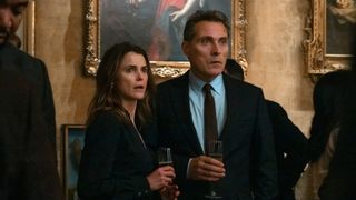 Kate (Keri Russell) and Hal Wyler (Rufus Sewell) (L-R) looking shocked in "The Diplomat" season 2