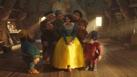 Rachel Zegler's Snow White surrounded by the seven dwarfs