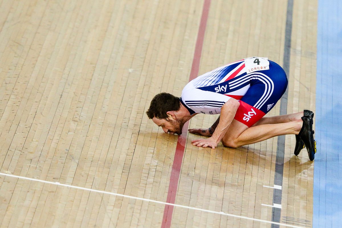 Bradley Wiggins kisses the boarding after winning the madison