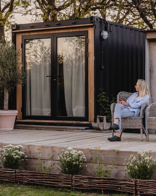 A shipping container transformed into an outdoor living space.