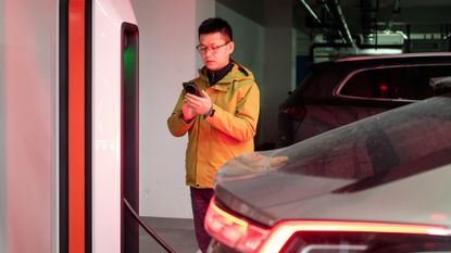 Man paying for car charging