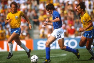 Paolo Rossi (centre) in action for Italy against Brazil at the 1982 World Cup.