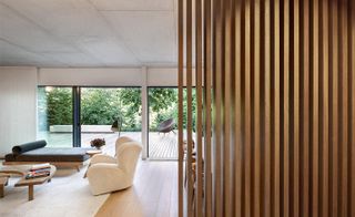 house interior with sofa and vertical timber slats